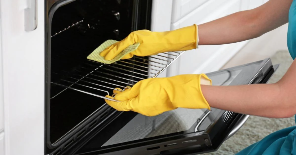 Cleaning the oven racks with soft kitchen cloth