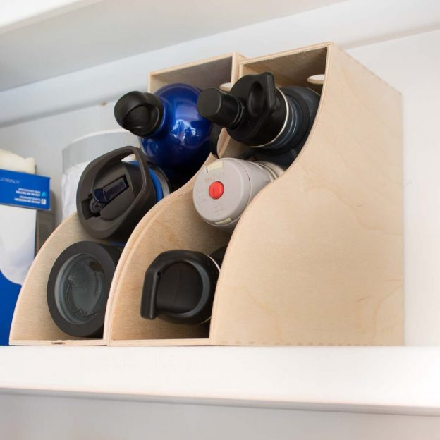 how to organize water bottles in kitchen using magazine rack