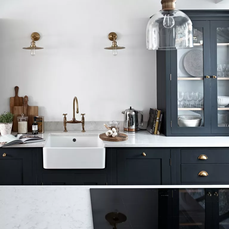 Black kitchen with brass fixtures