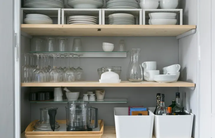 shelf risers to maximize kitchen cabinet storage - kitchen cabinet organization ideas