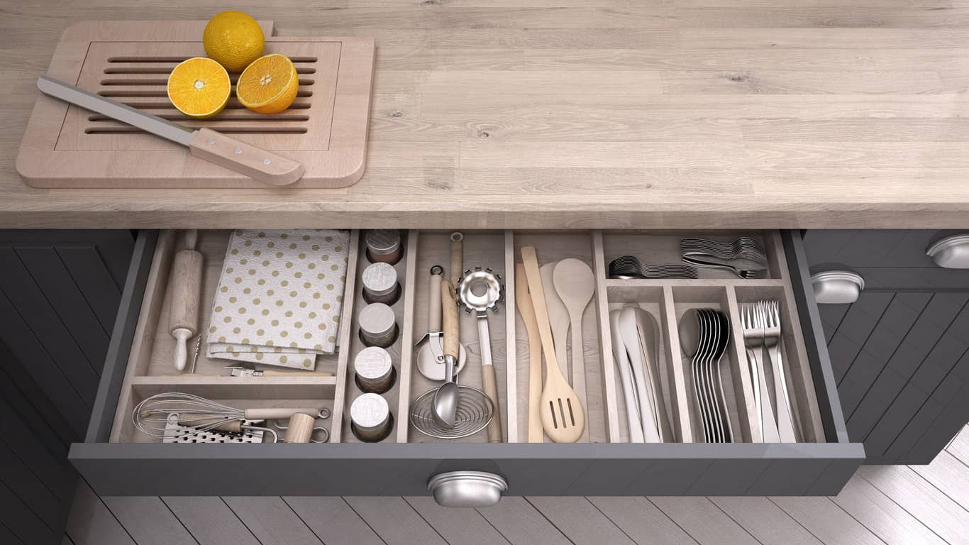 Kitchen utensil drawer with built-in dividers.