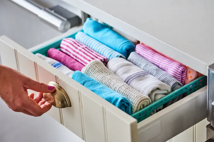 Folding kitchen towels using Marie Kondo's Method | kitchen towel organization ideas