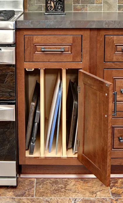 cutting boards stored in a kitchen cabinet