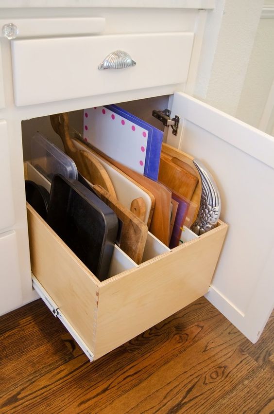 pull-out drawer for storing cutting boards in the kitchen