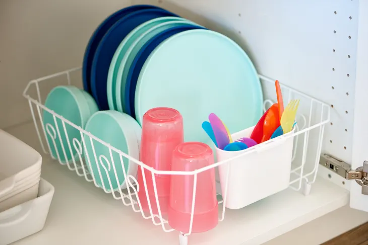 Kids dishes stored in dish rack